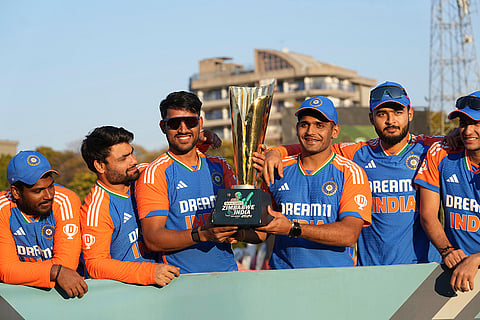 Indian players celebrate with the trophy